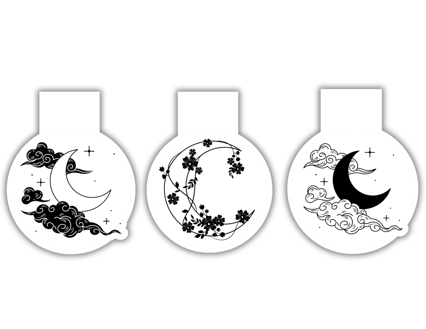 Three magnetic bookmarks with crescent moon and floral designs on a white background