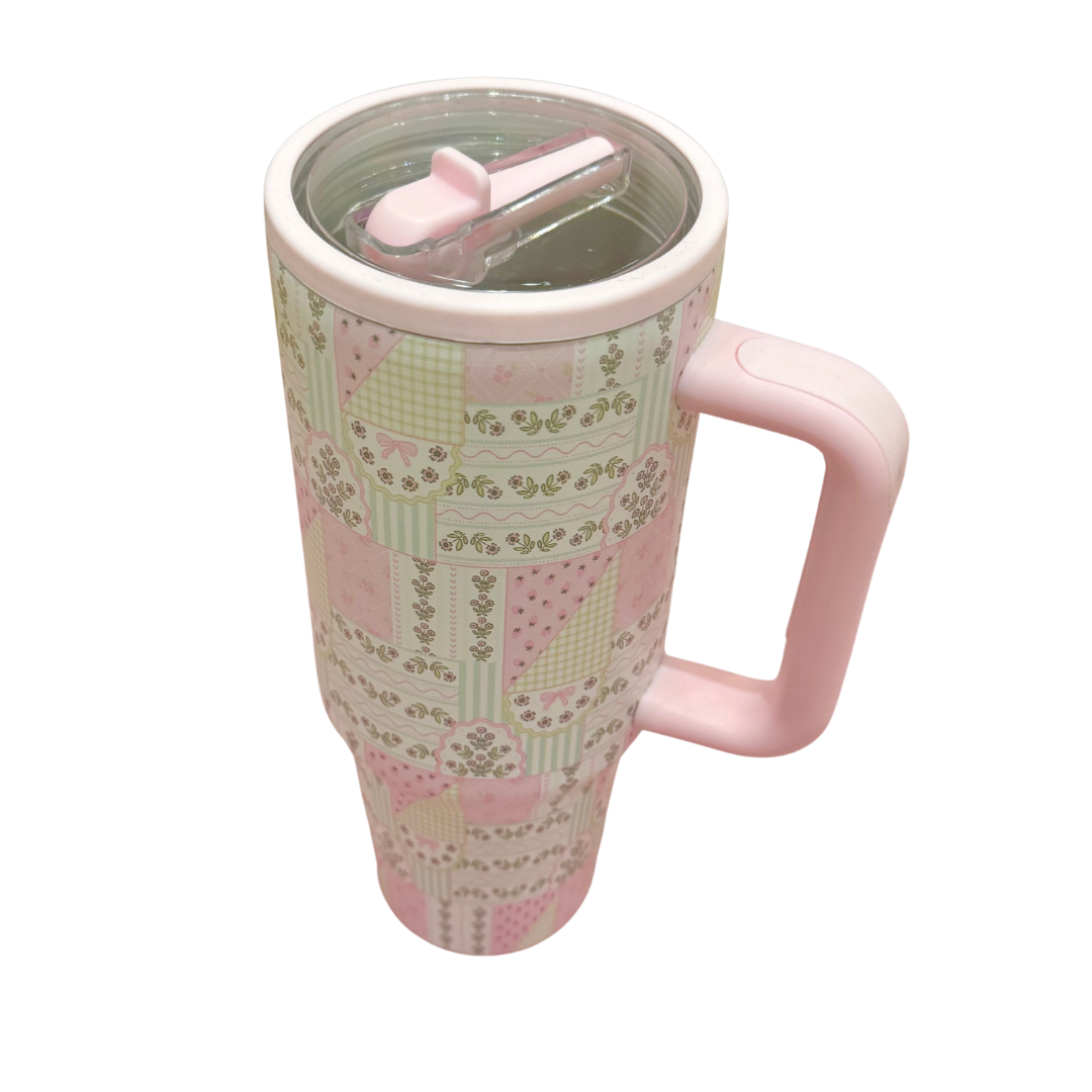 Patterned mug with pink handle on a white background