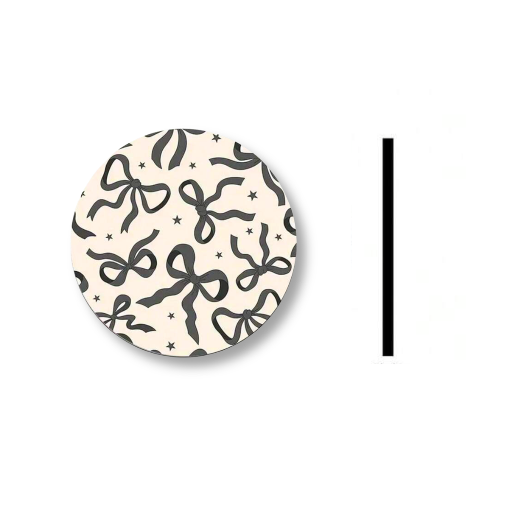 set of car coasters with black bow pattern design