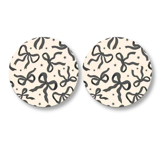 set of car coasters with black bow pattern design