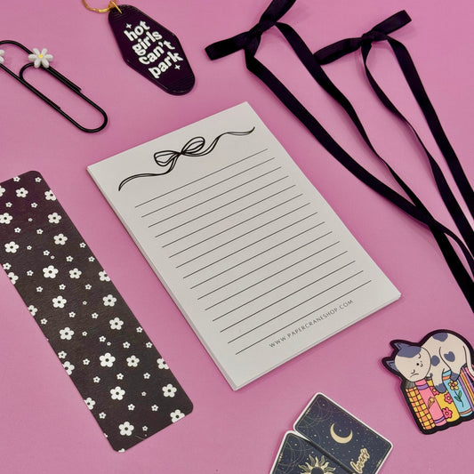 Notebook with decorative elements on a pink background