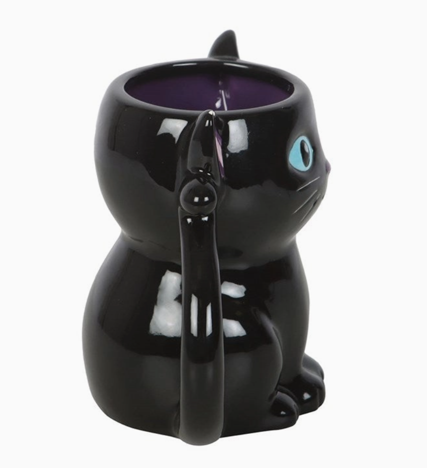 Black cat-shaped mug with a purple interior on a white background