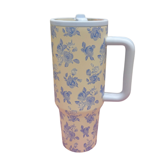 Floral-patterned mug with a white handle on a white background