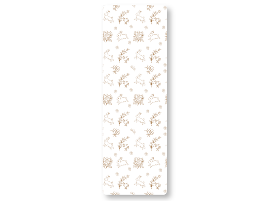 Patterned paper with floral and bunny designs on a white background