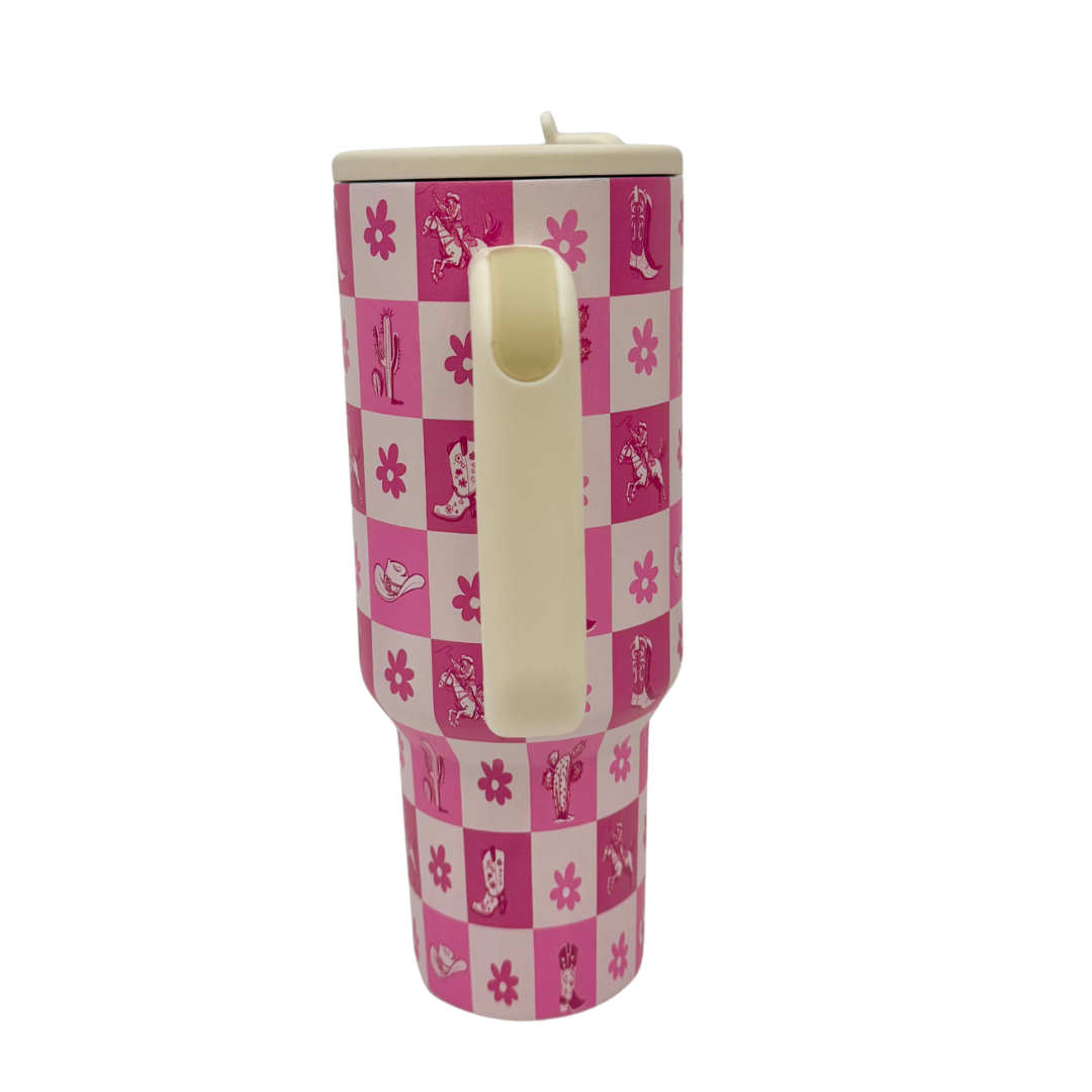 Pink and white tumbler with floral and cowgirl pattern on a white background