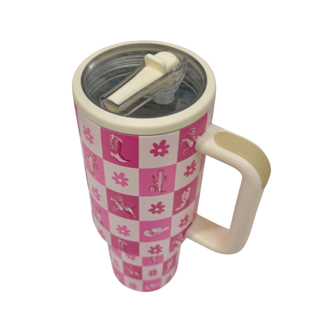 Travel mug with pink and white checkered pattern on a white background