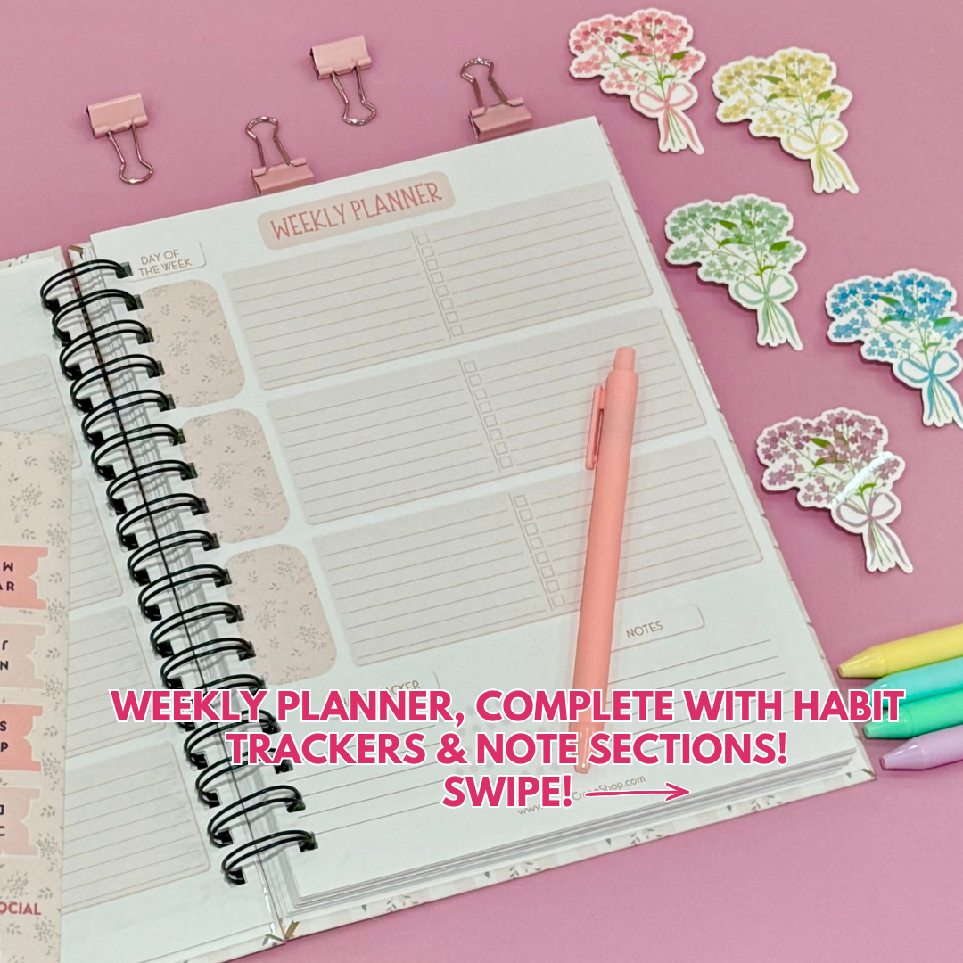Daily Planner surrounded by stationery items on a pink background