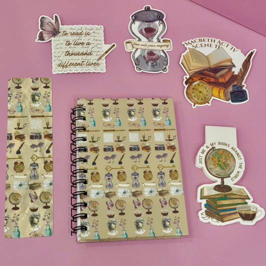 Notebook with vintage-style stickers on a pink background