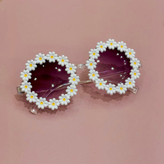 Sunglasses with floral design on a pink background