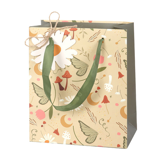 Gift bag with floral design and green handle on a white background