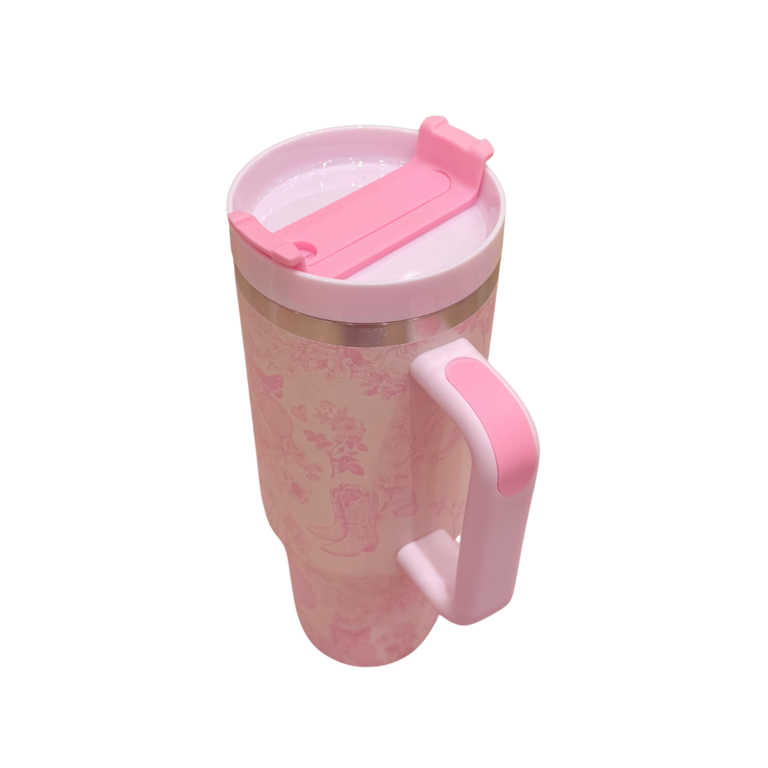 Pink travel mug with floral pattern on a white background