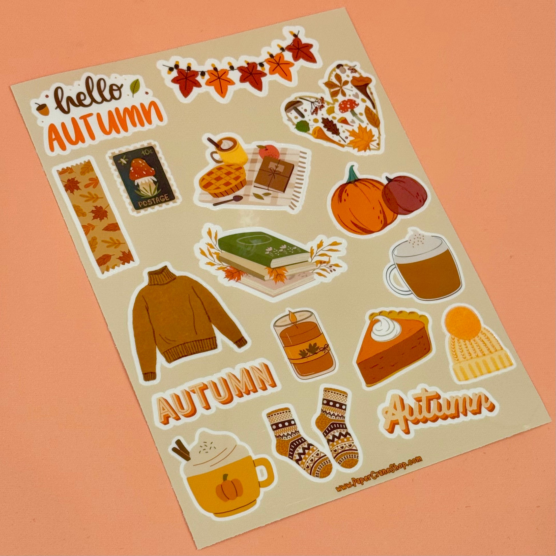 Sheet of autumn-themed stickers on a beige background