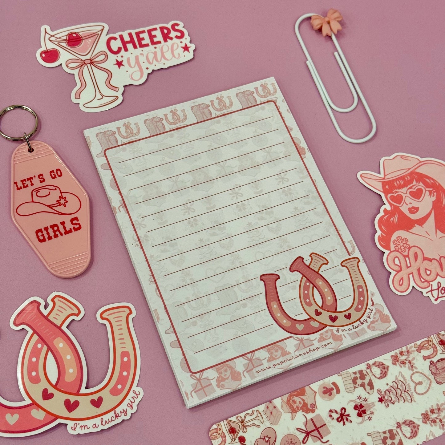 Notebook with decorative elements on a pink background