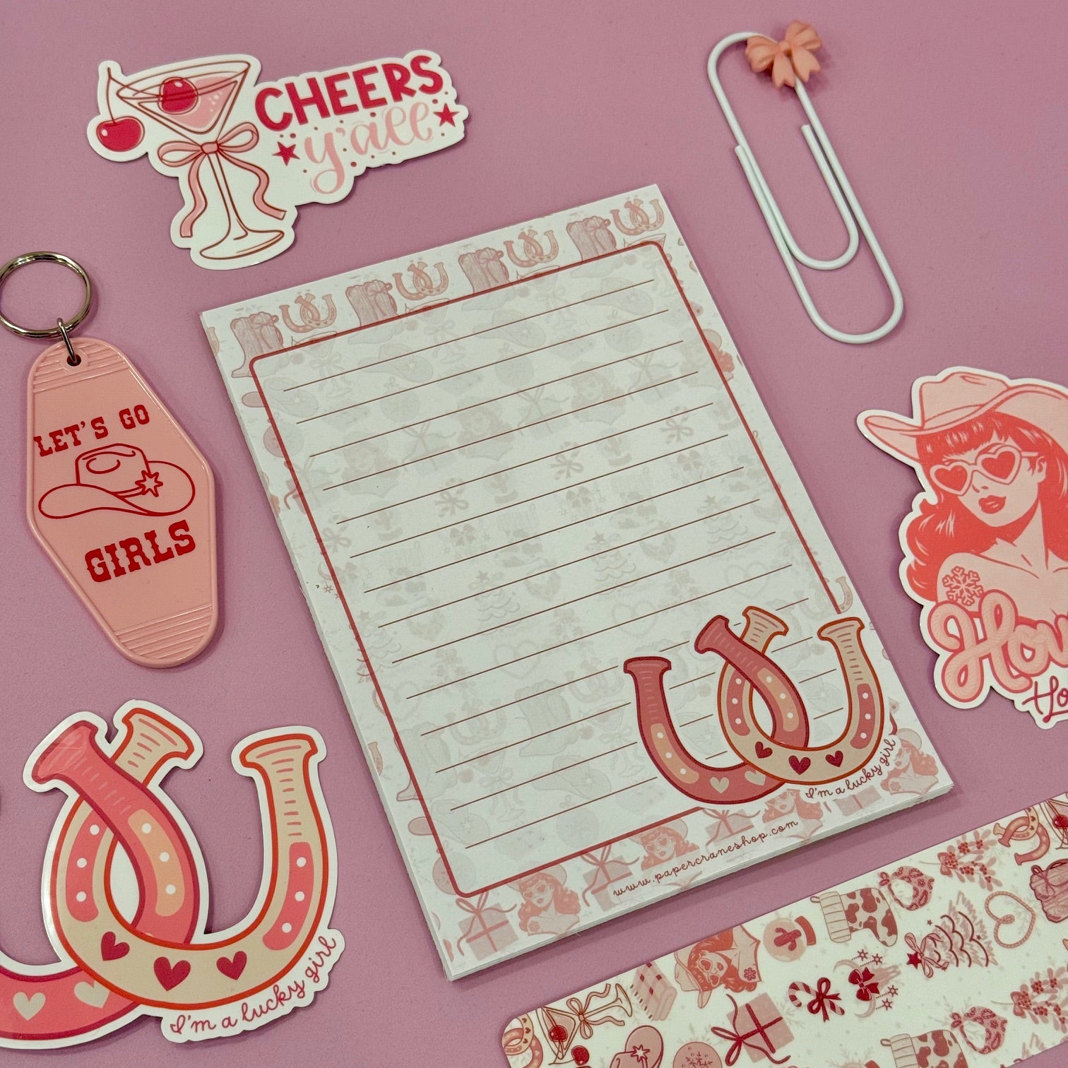 Notebook with decorative elements on a pink background