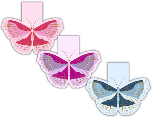Three moth-shaped magnetic bookmarks in pink, purple, and blue on a white background