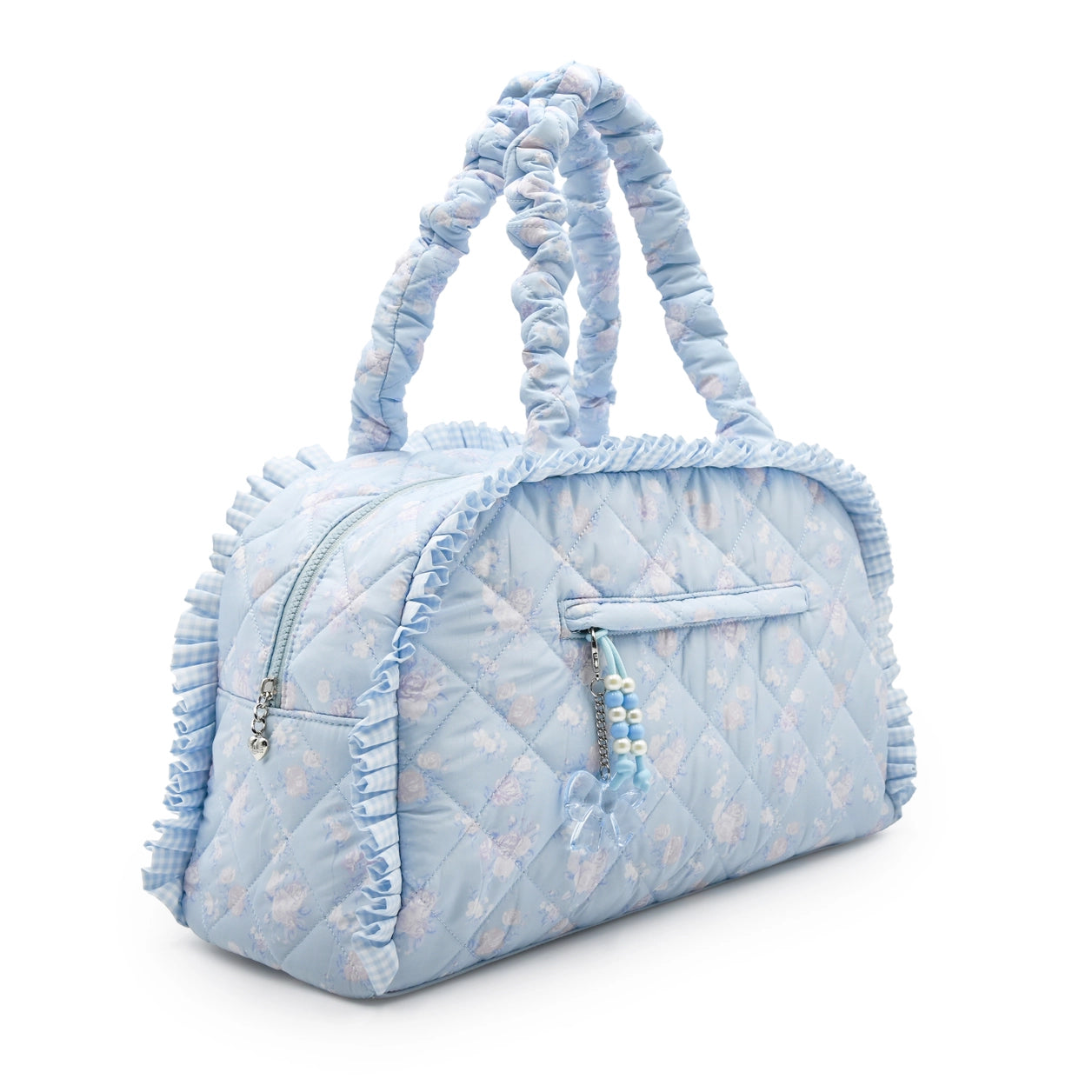 Medium quilted duffle bag lined with ruffles with a blue floral pattern