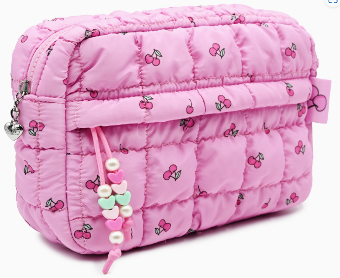 Pink quilted bag with cherry pattern on a white background