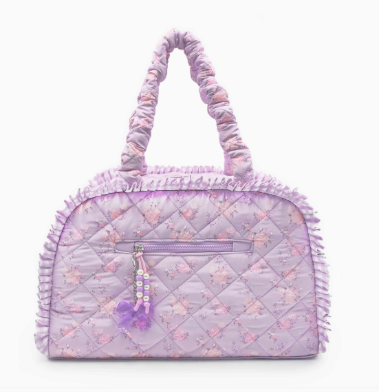 Quilted purple handbag with floral pattern on a white background