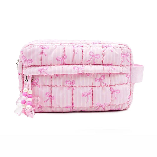 quilted pouch with bag charms and a striped bow pattern in pink