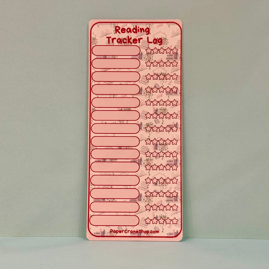Pink reading tracker log on a gray background