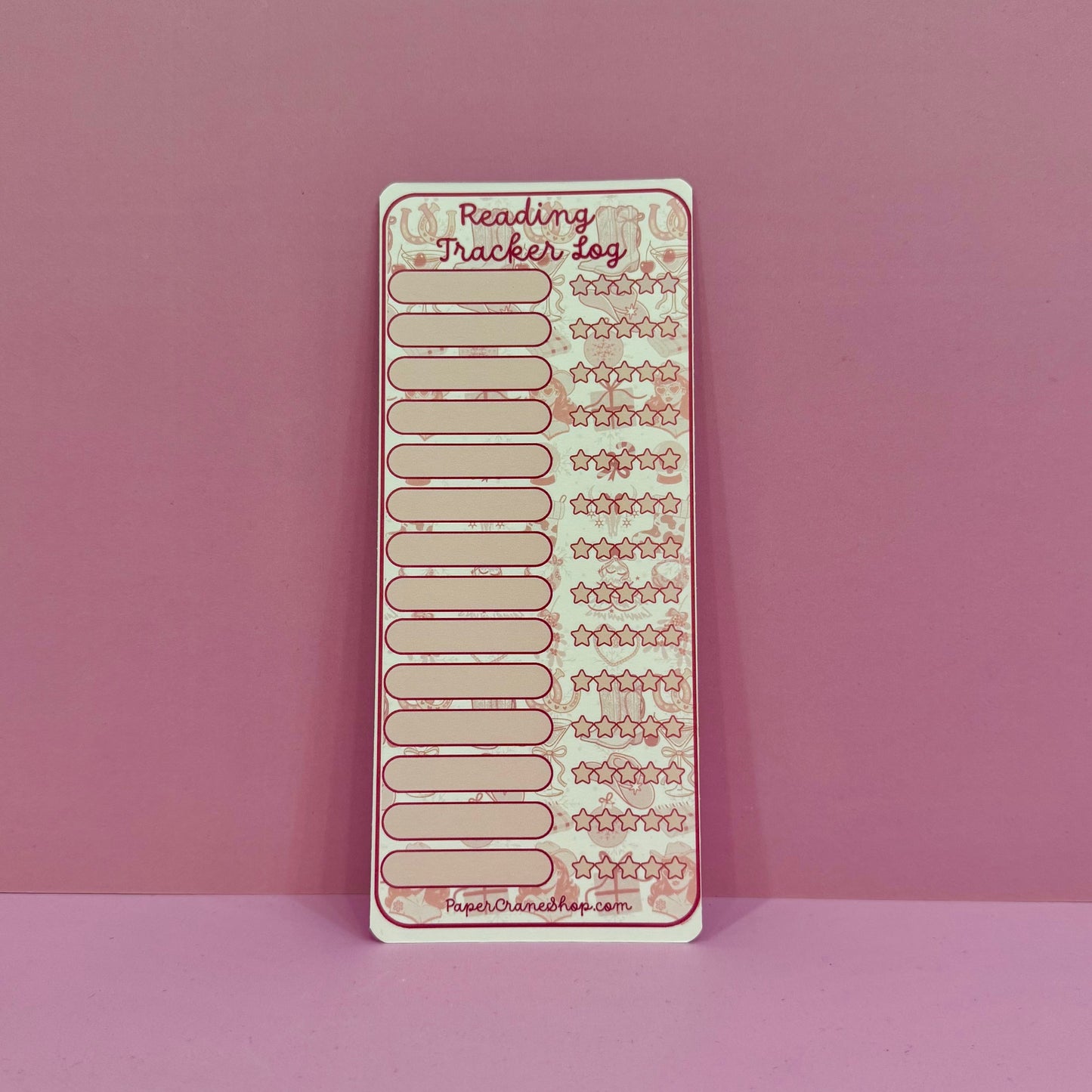 Reading tracker sheet on a pink background