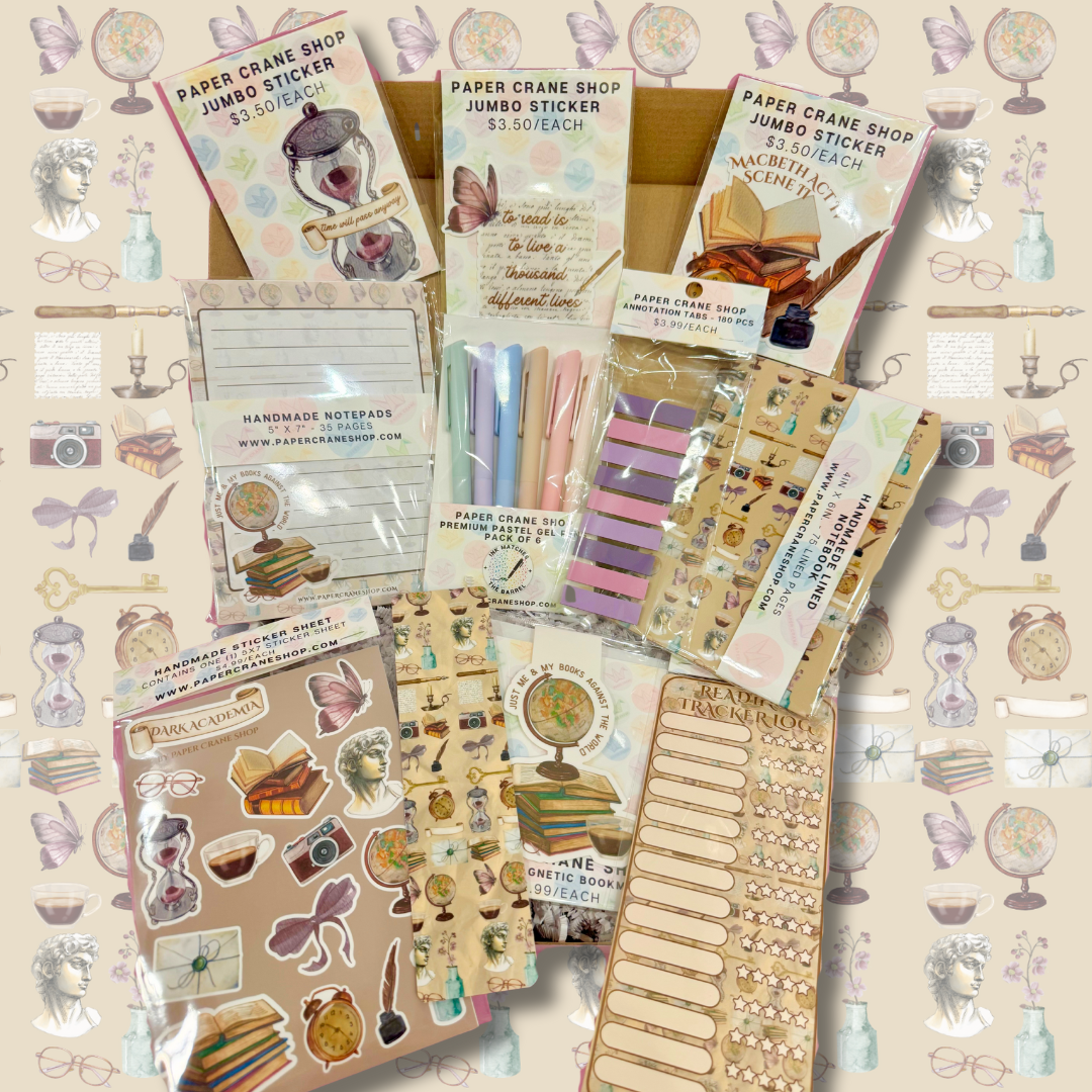 Collection of stationery items including stickers and notebooks on a patterned background