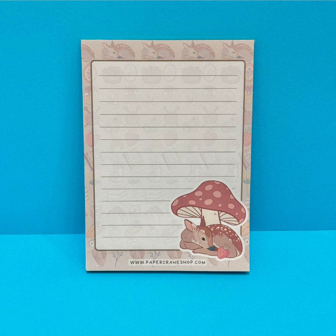 Notebook with a design of a deer and mushroom on a blue background
