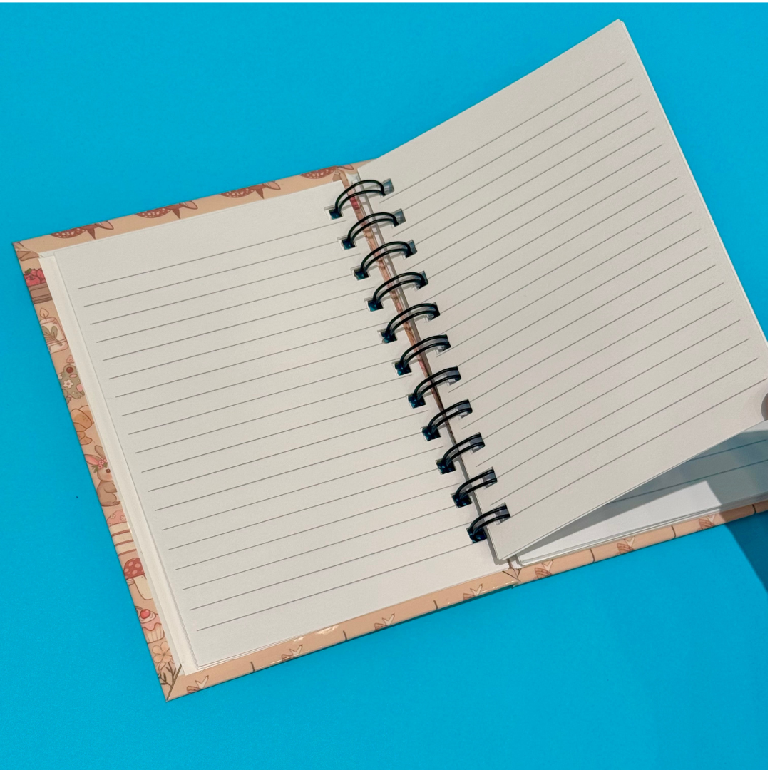Open notebook with lined pages on a blue background