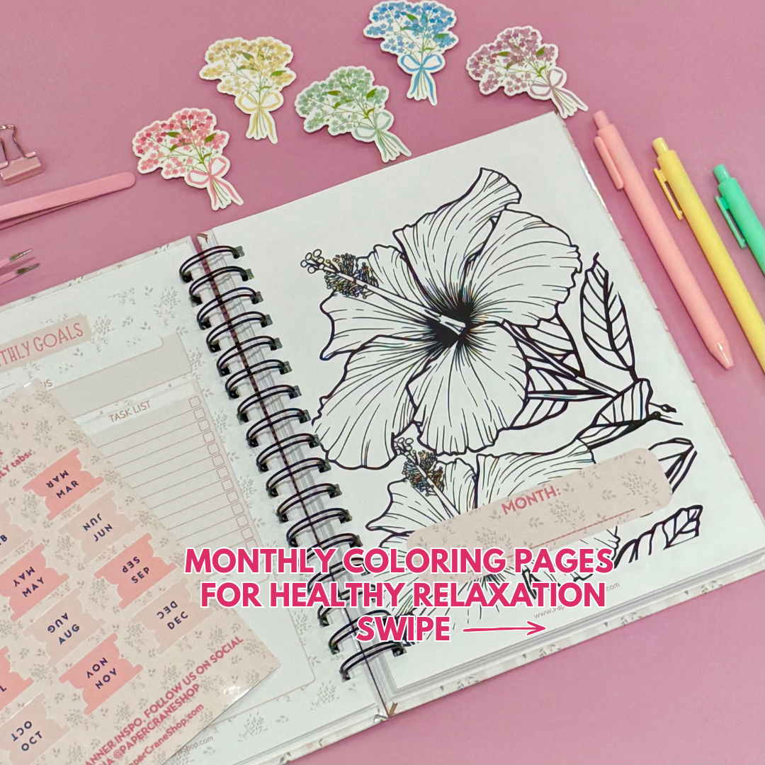 Daily Planner surrounded by stationery items on a pink background