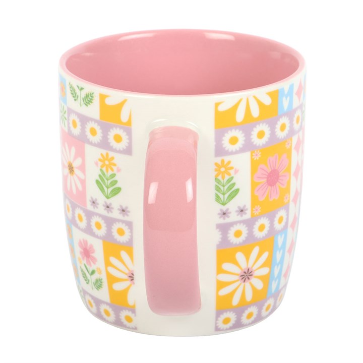 Colorful mug with floral pattern on a white background