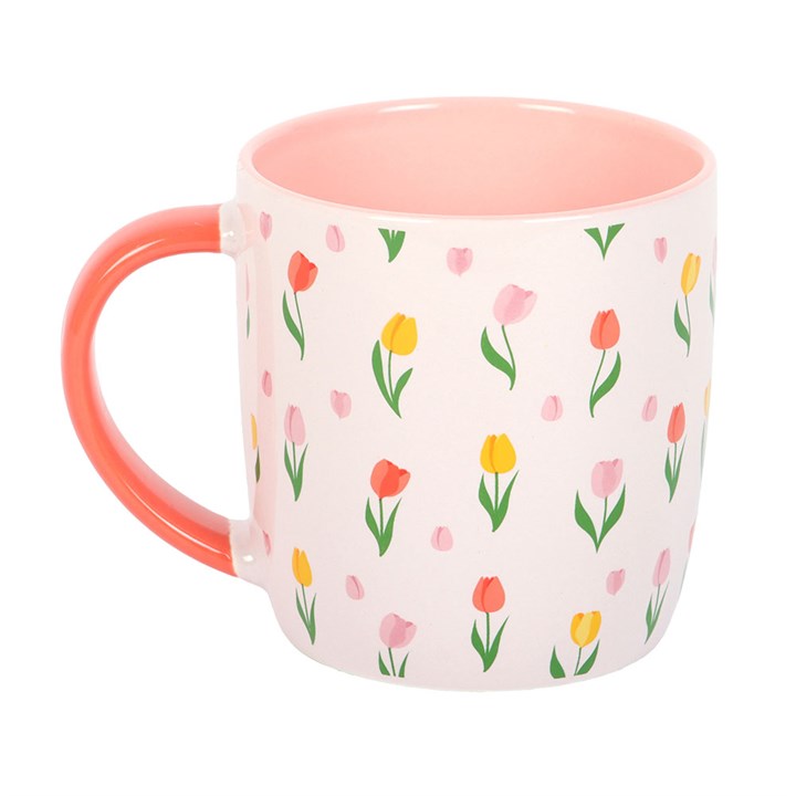 Mug with floral pattern and pink interior on a white background