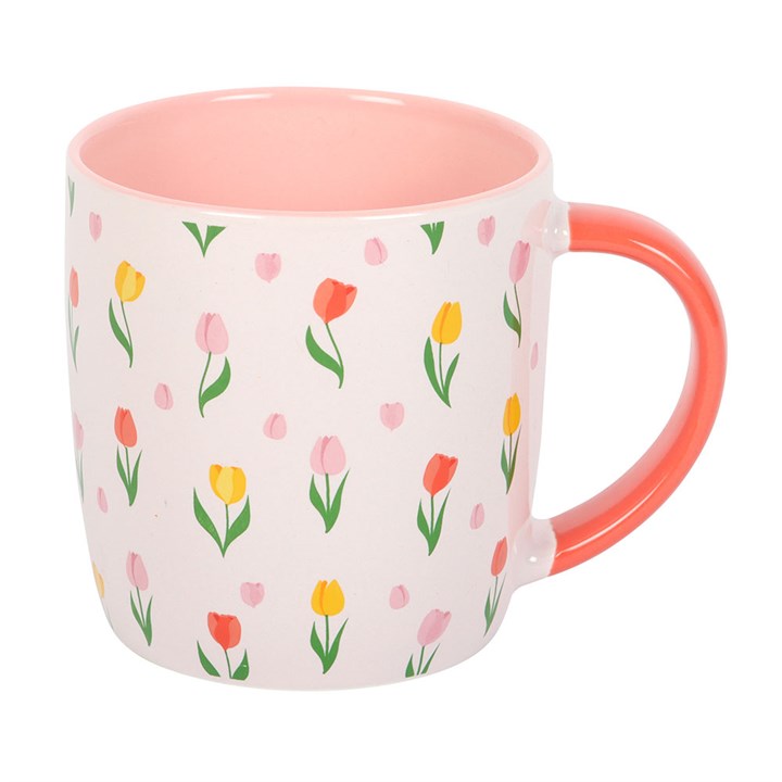 Mug with floral pattern and pink interior on a white background