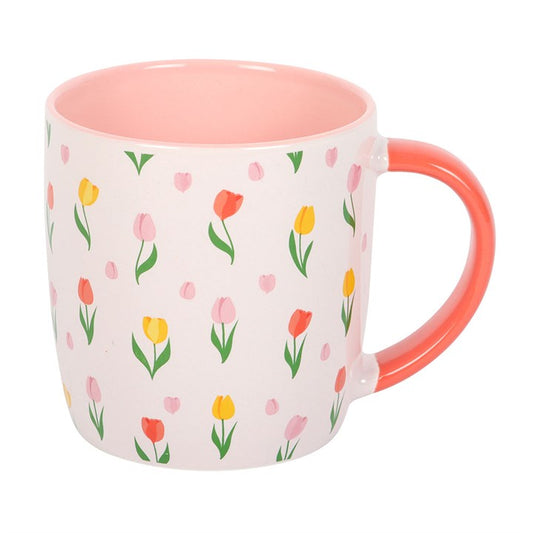 Mug with floral pattern and pink interior on a white background